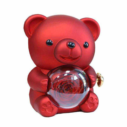 Eternal rose teddy bear holding rotating jewelry box with necklace